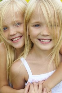 Twin girls with smiles 