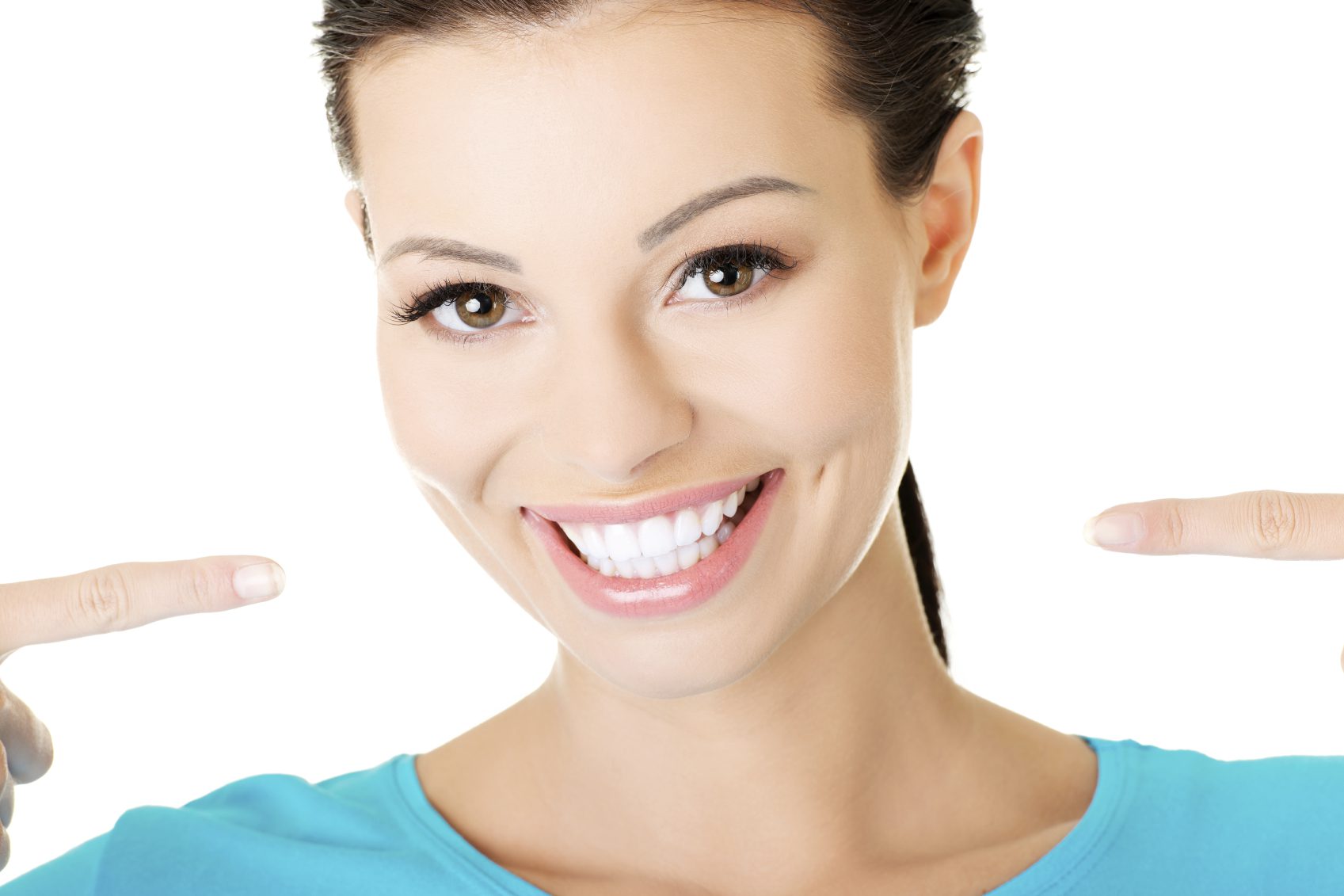 A woman with white teeth smiling for the camera.