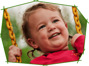 A child swinging on a swing set.